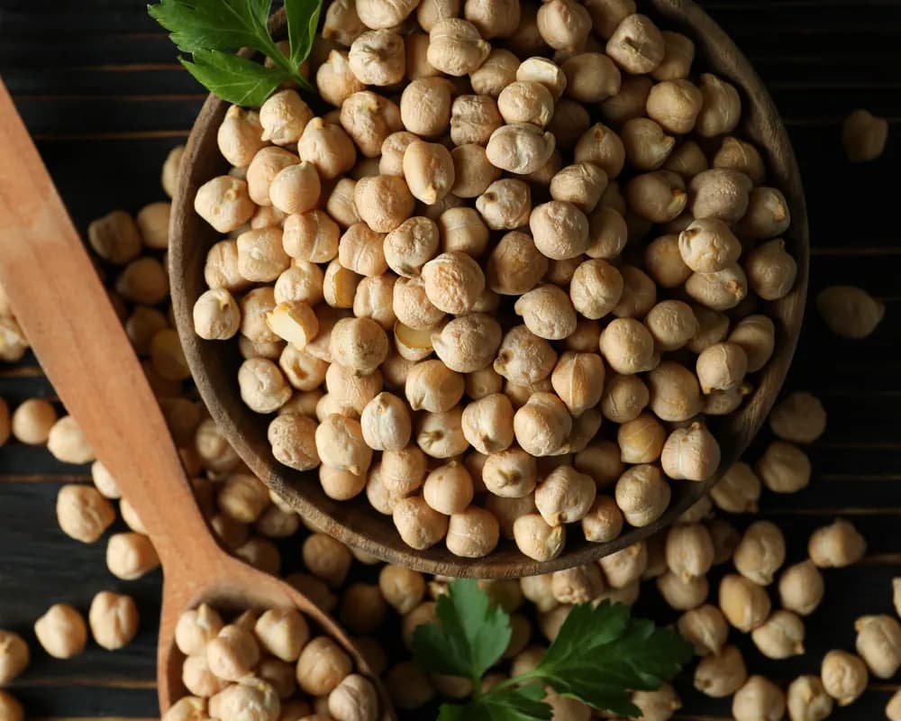 Wooden bowl of dried chickpeas