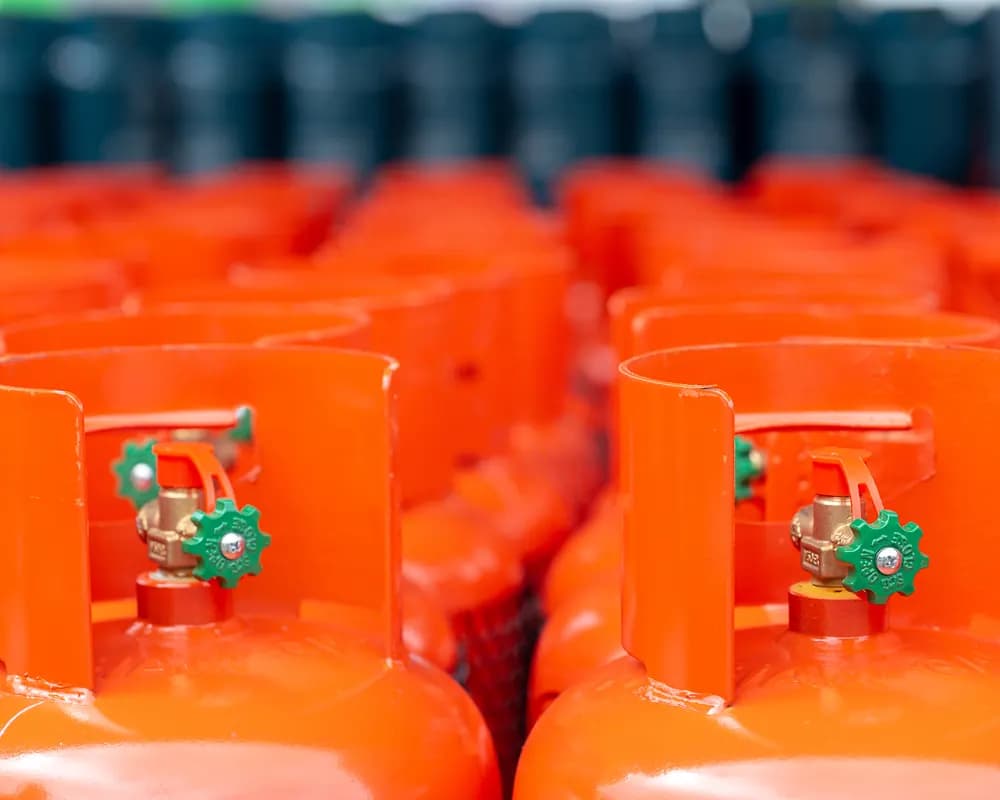 Rows of orange LPG cylinders