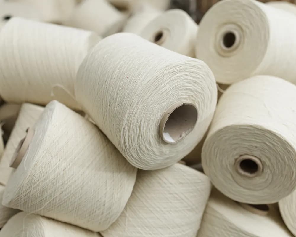 Spools of white cotton yarn